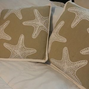 Two starfish throw pillows by Cynthia Rowley
